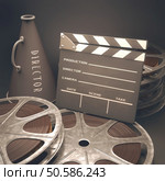 Clapperboard with rolls of film in the retro concept cinema. Стоковое фото, агентство Ingram Publishing / Фотобанк Лори