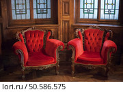 Beautiful and opulent antique red velvet chairs in timber interior. Red Velvet Chairs. Стоковое фото, агентство Ingram Publishing / Фотобанк Лори