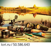 fishing tackle on a pontoon on the background of the lake . Стоковое фото, агентство Ingram Publishing / Фотобанк Лори