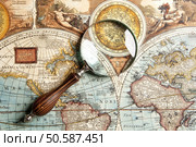 Magnifying glass and ancient old map . Стоковое фото, агентство Ingram Publishing / Фотобанк Лори