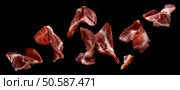 Falling sliced bacon isolated on black background, collection of raw ham strips. Falling sliced bacon isolated on black background. Стоковое фото, агентство Ingram Publishing / Фотобанк Лори