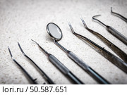Row of various dental tools (instruments). various dental instruments. Стоковое фото, агентство Ingram Publishing / Фотобанк Лори