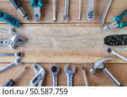Many tools on old wooden panel. Стоковое фото, агентство Ingram Publishing / Фотобанк Лори