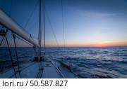 Sailing yacht race. Sailing ships yachts with white sails in the open sea. Стоковое фото, агентство Ingram Publishing / Фотобанк Лори
