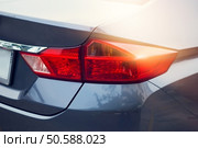Back light of city car on the street background . Стоковое фото, агентство Ingram Publishing / Фотобанк Лори