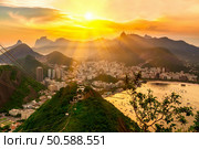 Sunset view of Corcovado and Botafogo in Rio de Janeiro. Brazil. Стоковое фото, агентство Ingram Publishing / Фотобанк Лори