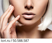 Women’s lips  closeup. unrecognizable person. half face. Стоковое фото, агентство Ingram Publishing / Фотобанк Лори