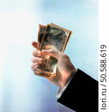 Businessman’s hand holding Yen. 24316749. Стоковое фото, агентство Ingram Publishing / Фотобанк Лори