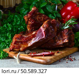 smoked meat , vegetables and greens  on a kitchen table. Стоковое фото, агентство Ingram Publishing / Фотобанк Лори