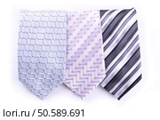 Three multi-colored tie isolated on white. Three tie. Стоковое фото, агентство Ingram Publishing / Фотобанк Лори