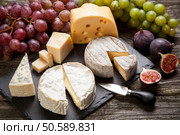 Assortment of cheese with fruits and grapes. French soft cheese. Стоковое фото, агентство Ingram Publishing / Фотобанк Лори