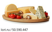 Board with assortment of delicious cheese, tomatoes and nuts on white background. Стоковое фото, агентство Ingram Publishing / Фотобанк Лори