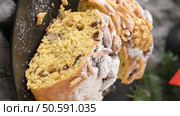 A close-up of a slice of Bolo Rainha, a traditional Portuguese sweet bread, sprinkled with powdered sugar and adorned with almonds and walnuts. Стоковое фото, агентство Ingram Publishing / Фотобанк Лори