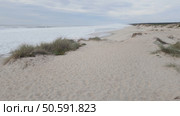 Expansive sandy dunes at Furadouro Beach, Portugal, where strong Atlantic storms accelerate coastal erosion processes. Стоковое фото, агентство Ingram Publishing / Фотобанк Лори