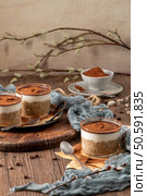 Savor a delectable tiramisu-inspired chia pudding, featuring layers of creamy coffee-infused chia and a decadent chocolate topping. This guilt-free breakfast or dessert blends classic flavors with wholesome ingredients for a convenient and satisfying treat. Стоковое фото, агентство Ingram Publishing / Фотобанк Лори