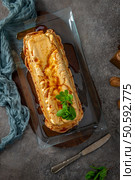 An overhead shot features a whole molotof, a traditional caramelized egg white pudding, generously drizzled with sweet syrup and garnished with fresh mint sprigs on a glass platter. Стоковое фото, агентство Ingram Publishing / Фотобанк Лори