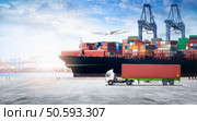 Container cargo freight ship during discharging at industrial port move to container yard by trucks, handlers, cargo plane, copy space, logistic import export background and transport industry concept. Стоковое фото, агентство Ingram Publishing / Фотобанк Лори