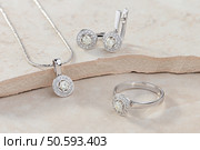 Elegant jewelry set of white gold ring, necklace and earrings with diamonds. Стоковое фото, агентство Ingram Publishing / Фотобанк Лори