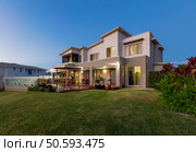 Modern multilevel house exterior with pool. Стоковое фото, агентство Ingram Publishing / Фотобанк Лори
