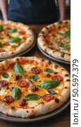 Authentic gourmet pizza selection served on restaurant table for sharing between friends during night out. Fresh ingredients and crispy crust on Italian traditional cuisine. Стоковое AI-видео, аниматор Sergey Grishin / Фотобанк Лори