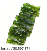 Laminaria seaweed sheets lying on white background. Стоковое AI-изображение, AI-художник Иван Рябоконь / Фотобанк Лори