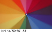 Multi-colored rainbow umbrella rotate. Стоковое видео, видеограф Михаил Коханчиков / Фотобанк Лори