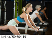 blonde woman performs exercises for the glutes and legs. Стоковое фото, фотограф Яков Филимонов / Фотобанк Лори