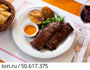 Grilled flank steaks with potatoes, jalapenos and chimichurri sauce. Стоковое фото, фотограф Яков Филимонов / Фотобанк Лори
