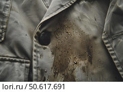 Water repellent fabric resisting mud stain, demonstrating waterproof technology. Стоковое AI-изображение, AI-художник Иван Рябоконь / Фотобанк Лори