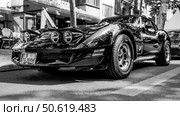 BERLIN - MAY 10, 2025: Classic American sports car Chevrolet Corvette C3, 1970s, on the street. Black and white. Classic Days Berlin. Редакционное фото, фотограф Sergey Kohl / Фотобанк Лори
