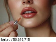 Cropped face of young woman holding a syringe with botox or hyaluronic acid near her lips, symbolizing modern aesthetic treatments aimed at enhancing facial beauty and youthful appearance. Стоковое AI-изображение, AI-художник Ирина Михайличенко / Фотобанк Лори