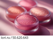 Vibrant color palette featuring powders, blushes, and highlighters arranged on a soft pink background. Beauty and variety of makeup essentials, perfect for cosmetic advertising and creative promotions. Стоковое AI-изображение, AI-художник Ирина Михайличенко / Фотобанк Лори