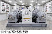 Powerful industrial electric motors powering a ventilation system in engine room. Стоковое AI-изображение, AI-художник Юрий Поздников / Фотобанк Лори
