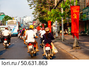 Traffic and Banners on a Street in Ho Chi Minh City, Vietnam (2024 год). Редакционное фото, фотограф Aleksandr Golubev / Фотобанк Лори