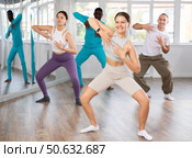 European girl with team of like-minded multinational people learn to elements of electro dance. Стоковое фото, фотограф Яков Филимонов / Фотобанк Лори
