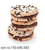 Stack of delicious chocolate chip cookies with filling creating a tempting treat. Стоковое AI-изображение, AI-художник Иван Рябоконь / Фотобанк Лори
