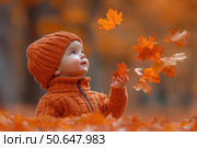 Little boy having fun during stroll in the forest at sunny autumn day. Child playing maple leaves. Baby tossing the leaves up. Active family time on nature. Hiking with little kids. Dry leaves rustle. Стоковое AI-изображение, AI-художник Ирина Михайличенко / Фотобанк Лори