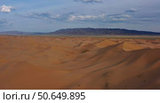 Aerial view of sand dunes in desert at sunset. Стоковое фото, фотограф Михаил Коханчиков / Фотобанк Лори