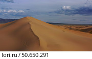 Aerial view of sand dunes in desert at sunset. Стоковое фото, фотограф Михаил Коханчиков / Фотобанк Лори
