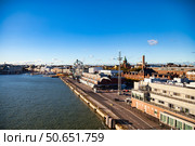 Panoramic View of Helsinki Waterfront Featuring Cityscape and Ferris Wheel (2024 год). Редакционное фото, фотограф Aleksandr Golubev / Фотобанк Лори