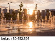 Russia, Moscow - 06 July 2020:   Khodynka field, Park and residential area. Fountain at sunset of a summer day. Редакционное фото, фотограф Татьяна Васильева / Фотобанк Лори