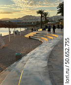 Promenade along the sea in Eilat on background of sunset. Редакционное фото, фотограф Irina Opachevsky / Фотобанк Лори