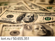 Us dollar bills creating a background of finance and wealth. Стоковое AI-изображение, AI-художник Иван Рябоконь / Фотобанк Лори