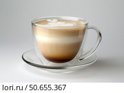 Latte macchiato coffee in double walled glass cup on white background. Стоковое AI-изображение, AI-художник Иван Рябоконь / Фотобанк Лори