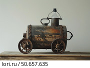 Rusty toy train crafted from recycled materials evokes nostalgia. Стоковое AI-изображение, AI-художник Иван Рябоконь / Фотобанк Лори