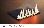 Paper document burning with flames on wooden surface with words "I'm sorry" Стоковое AI-видео, аниматор KATERINA AI / Фотобанк Лори