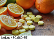 Vitamin c supplement providing immune support with fresh citrus fruits. Стоковое AI-изображение, AI-художник Иван Рябоконь / Фотобанк Лори