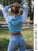 Young girl in sports blue hoodie outdoors. Стоковое фото, фотограф Роготнева Виктория / Фотобанк Лори