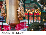 A large samovar with bagels and bagels on Tverskaya Street. Hot tea from a traditional Russian samovar at New Year's celebrations in Moscow. Стоковое фото, фотограф Photojuli / Фотобанк Лори