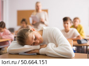 School girl lying and sleeping at desk. Стоковое фото, фотограф Яков Филимонов / Фотобанк Лори
